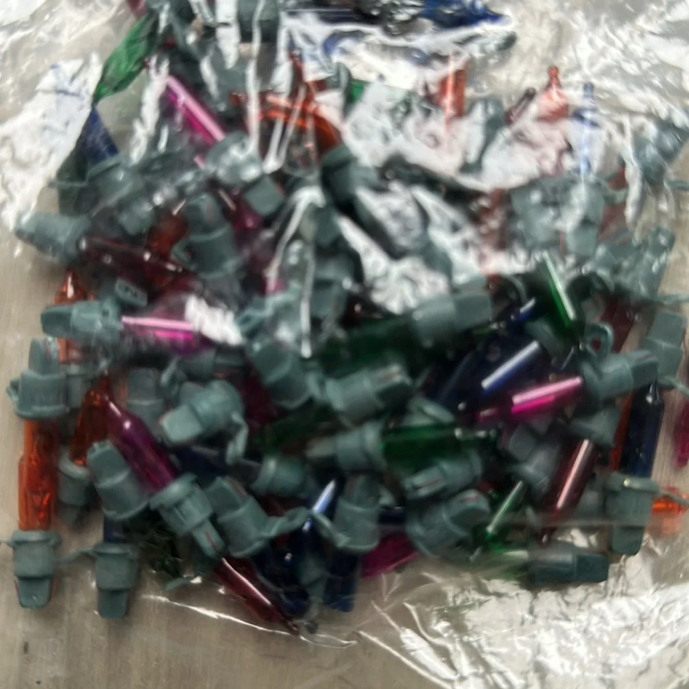 Bags of mini holiday Christmas mini light bulbs. Different brands.
